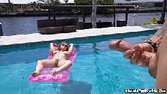 Busty teen relaxes naked in her pool